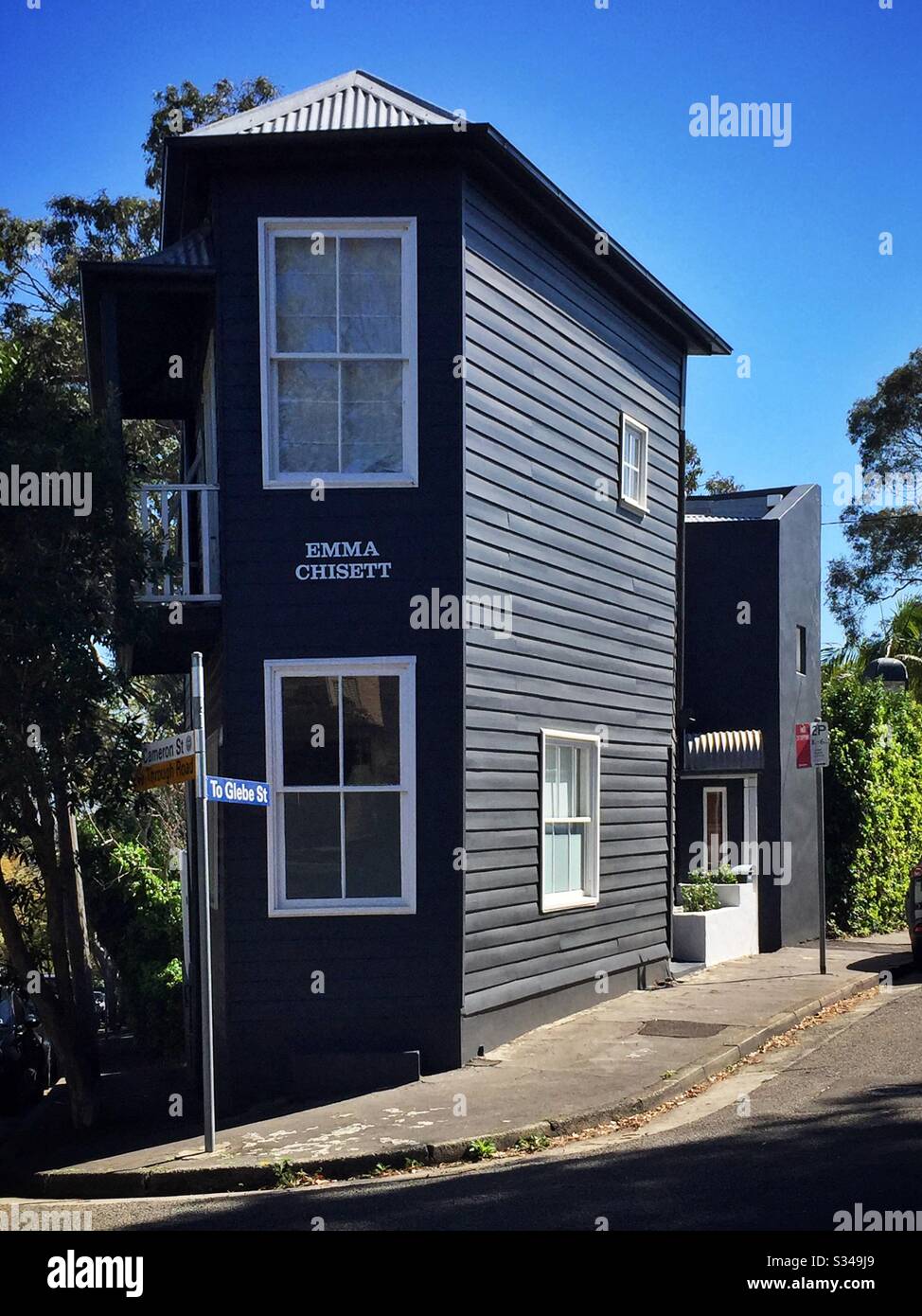 A renovated 1860 weatherboard corner store in Edgcliff, Sydney, NSW, Australia. The name 'Emma Chisett' is a Strine variant of the request 'How much is it?' Stock Photo