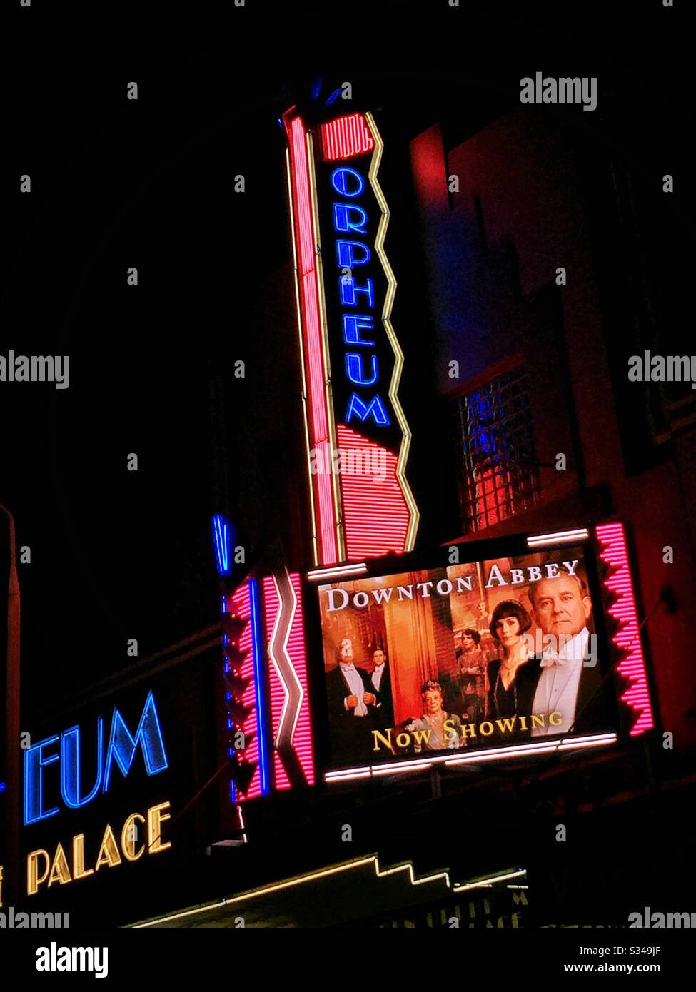 The street façade of the Hayden Orpheum Picture Palace, a heritage-listed Art Deco style cinema complex, at night in Cremorne, Sydney, NSW, Australia - Smartphone Captured Stock Image