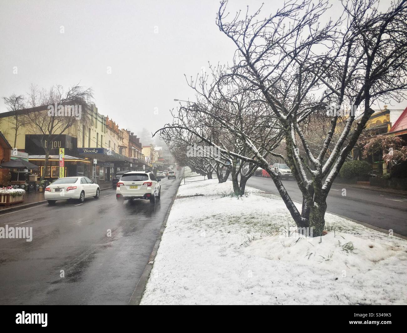 The village of Leura under an unseasonal spring snowfall, Blue Mountains, NSW, Australia - Smartphone Captured Stock Image