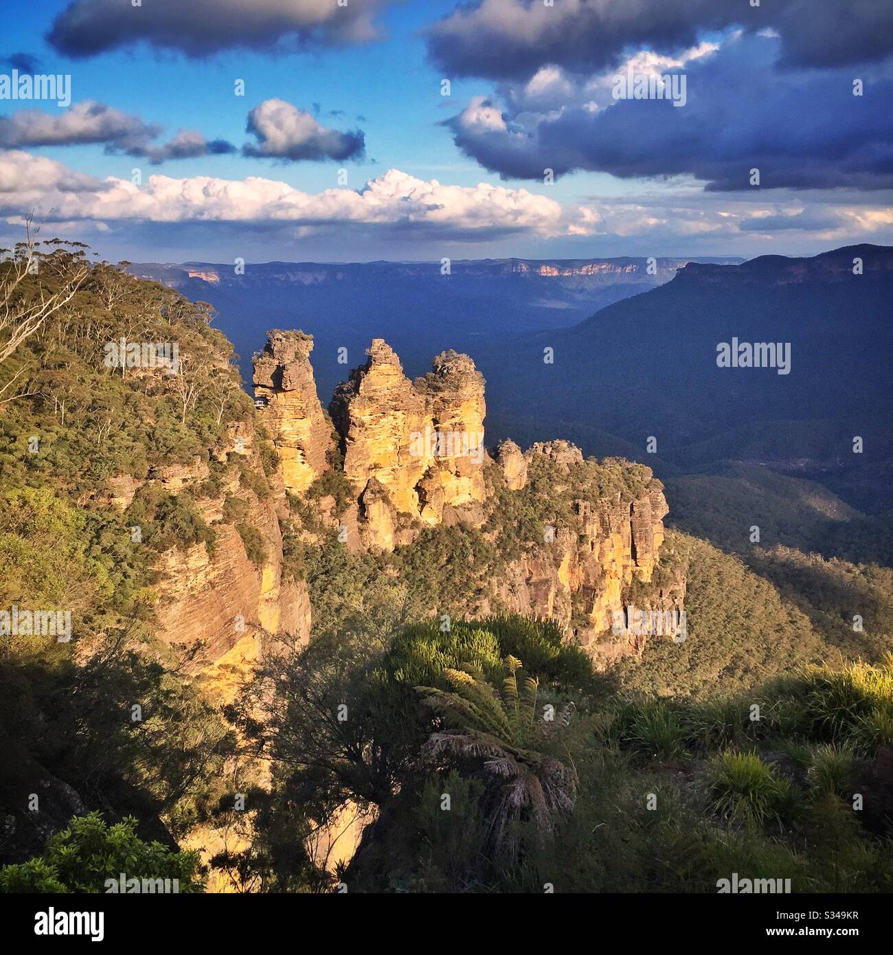 Late afternoon sunlight Illuminates the Three Sisters in the Blue Mountains, National Park, NSW, Australia - Smartphone Captured Stock Image