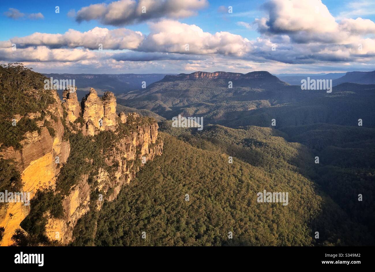 Late afternoon sunlight illuminates the Three Sisters in the Blue Mountains, National Park, NSW, Australia - Smartphone Captured Stock Image