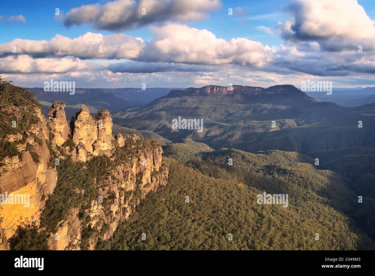 Late afternoon sunlight illuminates the Three Sisters in the Blue Mountains, National Park, NSW, Australia - Smartphone Captured Stock Image