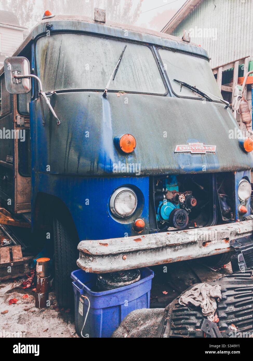 Classic blue Chevy van being renovated at Seattle service station - Smartphone Captured Stock Image