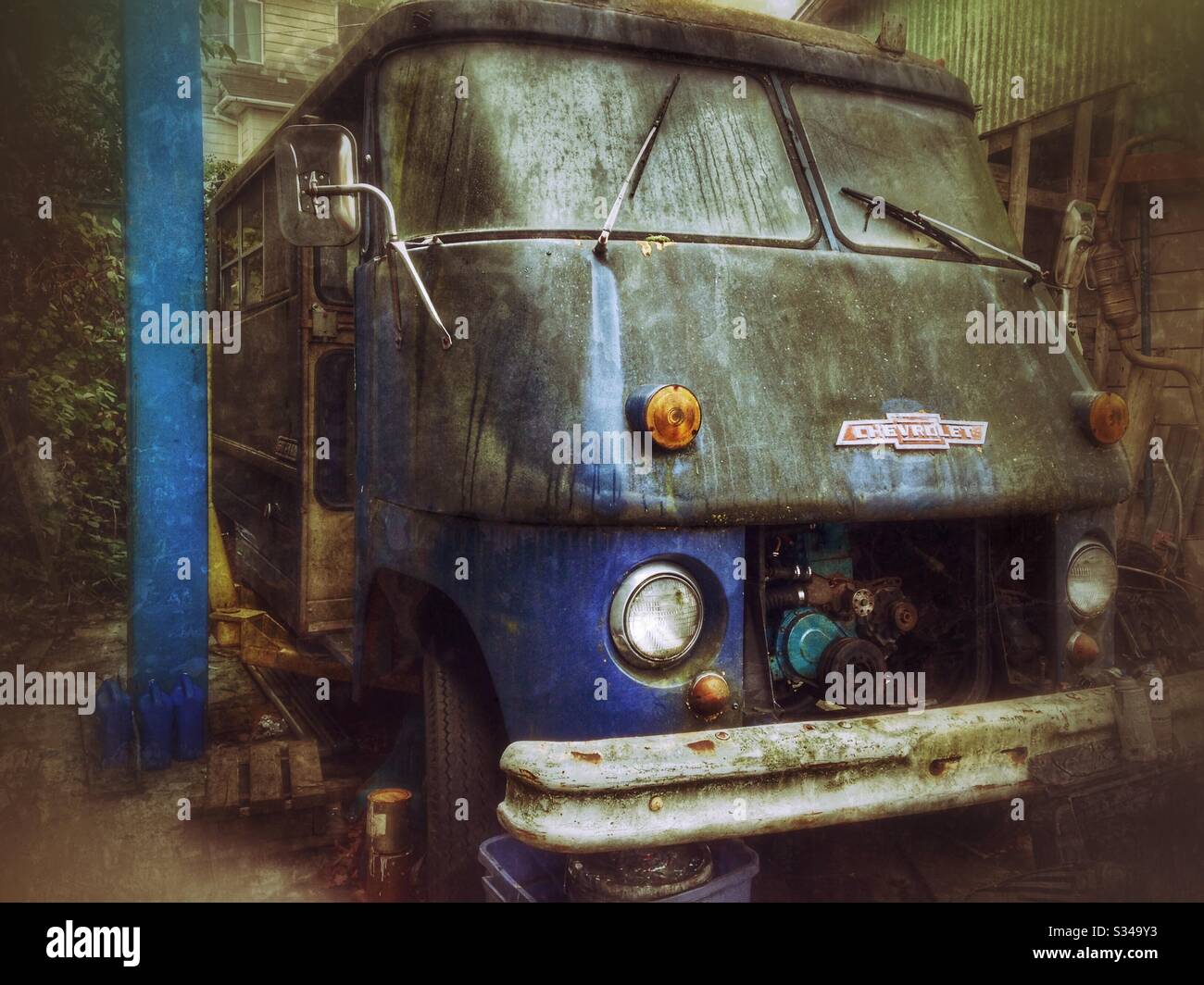 Grunge photo of vintage blue Chevrolet van undergoing restoration at Seattle service station - Smartphone Captured Stock Image