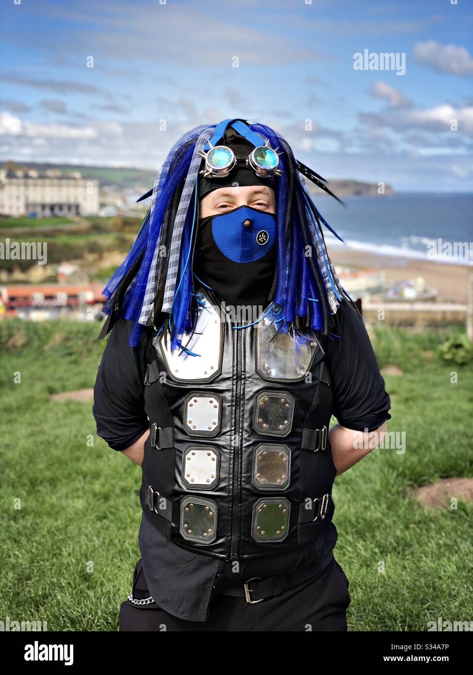 A man is seen wearing a creative steampunk costume during the Whitby Goth Weekend cosplay event - Smartphone Captured Stock Image