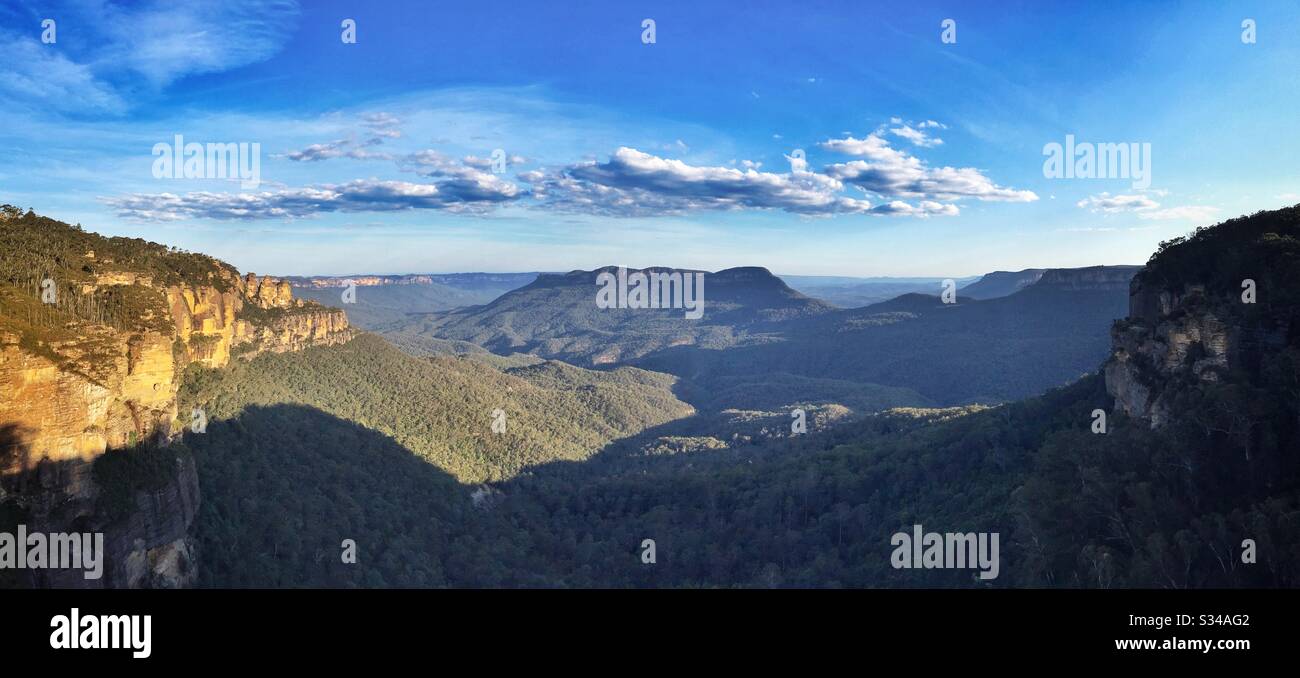 Late afternoon sunlight Illuminates the Three Sisters, Mount Solitary and the Jamison Valley in the Blue Mountains National Park, NSW, Australia - Smartphone Captured Stock Image