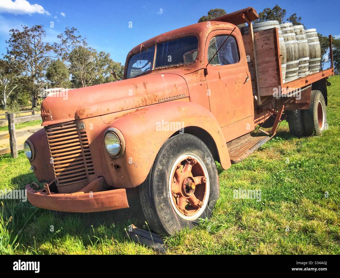 An old, disused International truck marks the entrance to a small vineyard in the Megalong Valley, to the west of the Blue Mountains, NSW, Australia Stock Photo