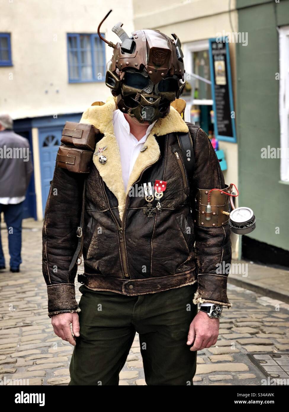 Person in a creative costume during a cosplay event. Whitby Goth Weekend. Front portrait of a steampunk man - Smartphone Captured Stock Image