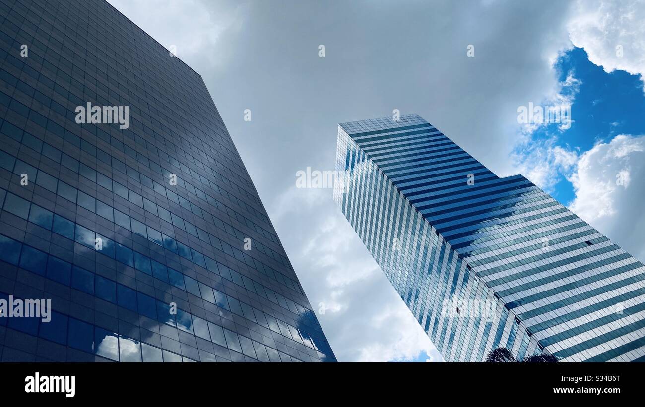 LOS ANGELES, CA, MAR 2020: clouds and blue sky reflect in windows on skyscrapers in the Financial District of Downtown - Smartphone Captured Stock Image