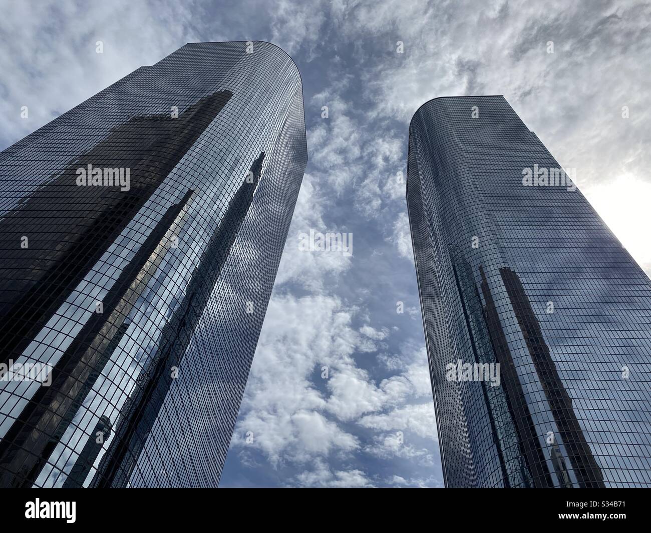 LOS ANGELES, CA, MAR 2020: clouds and blue sky reflect in windows on skyscrapers at California Plaza in the Financial District of Downtown - Smartphone Captured Stock Image