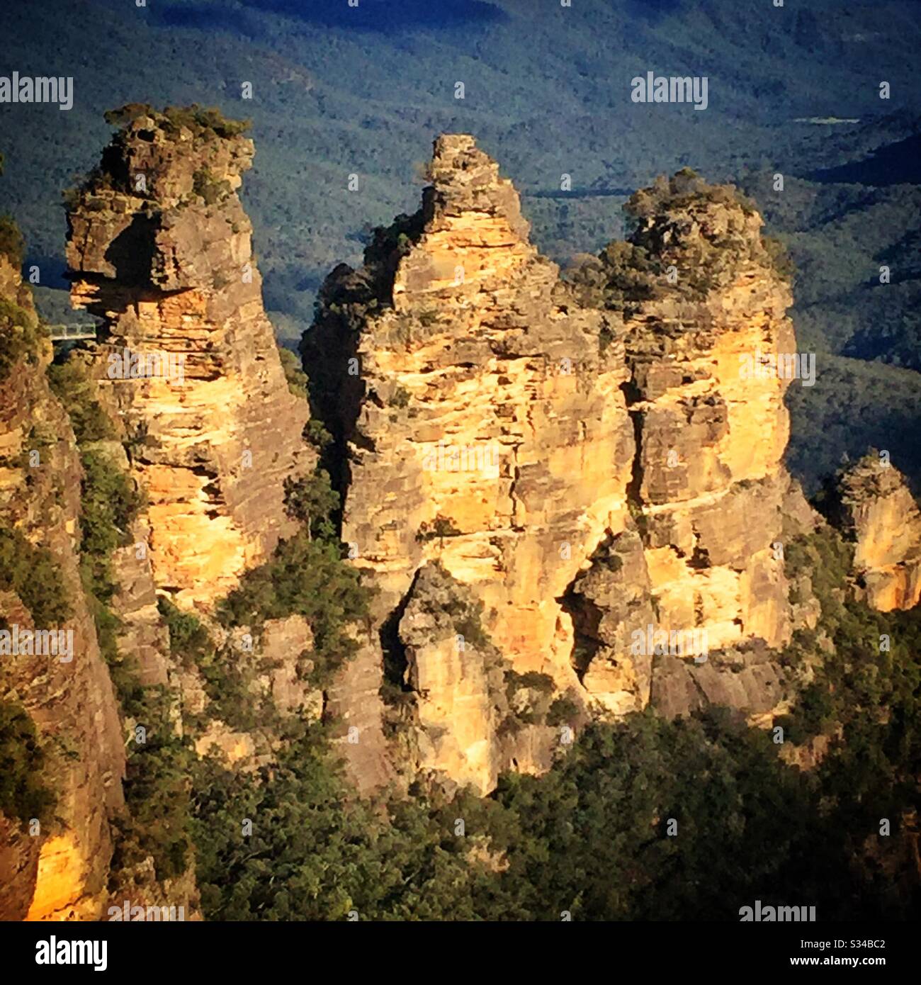Late afternoon sunlight Illuminates the Three Sisters in the Blue Mountains, National Park, NSW, Australia - Smartphone Captured Stock Image