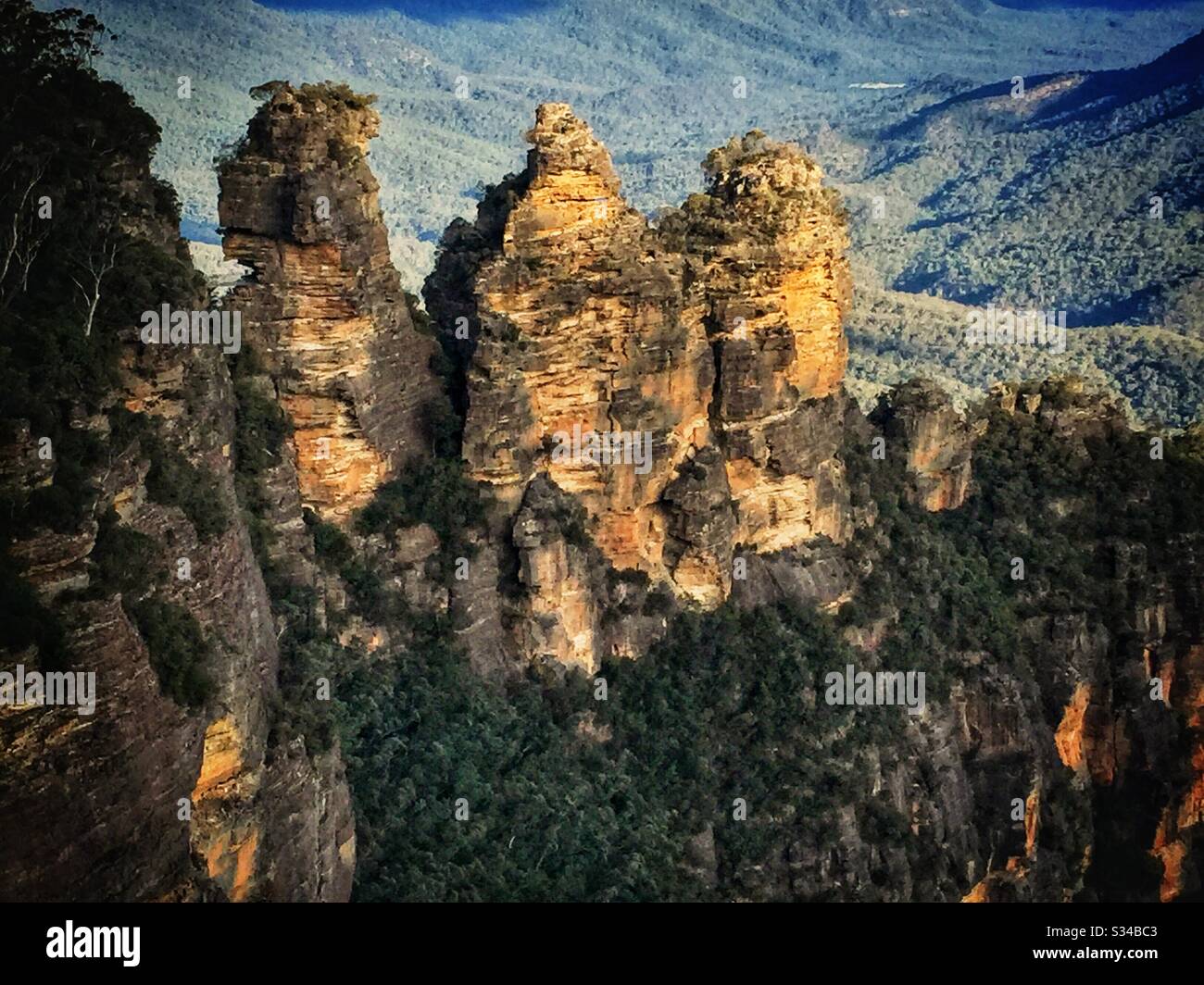 Late afternoon sunlight Illuminates the Three Sisters in the Blue Mountains, National Park, NSW, Australia - Smartphone Captured Stock Image