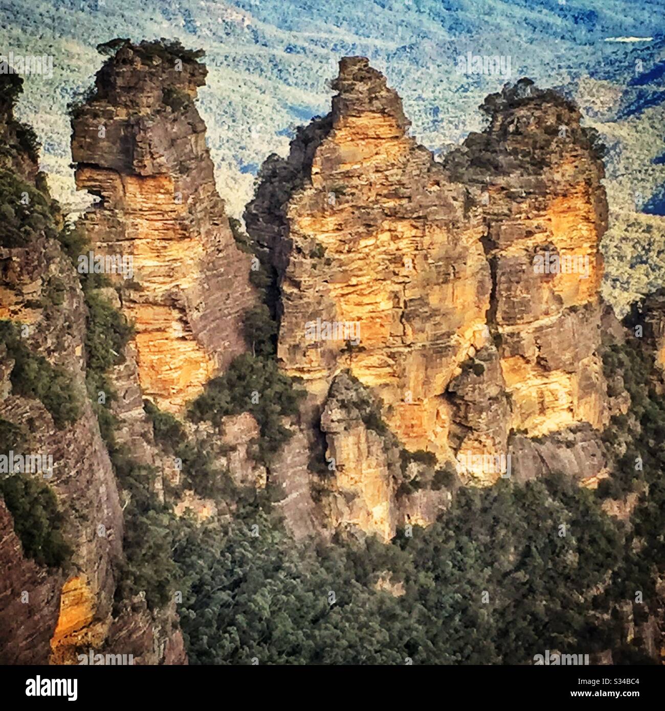 Late afternoon sunlight Illuminates the Three Sisters in the Blue Mountains, National Park, NSW, Australia - Smartphone Captured Stock Image
