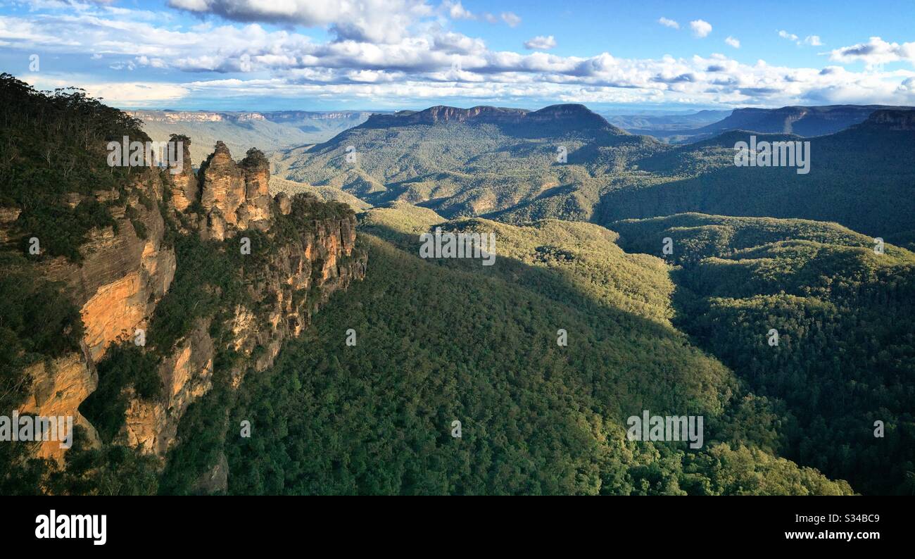 Late afternoon sunlight Illuminates the Three Sisters, Mount Solitary and the Jamison Valley in the Blue Mountains, National Park, NSW, Australia - Smartphone Captured Stock Image