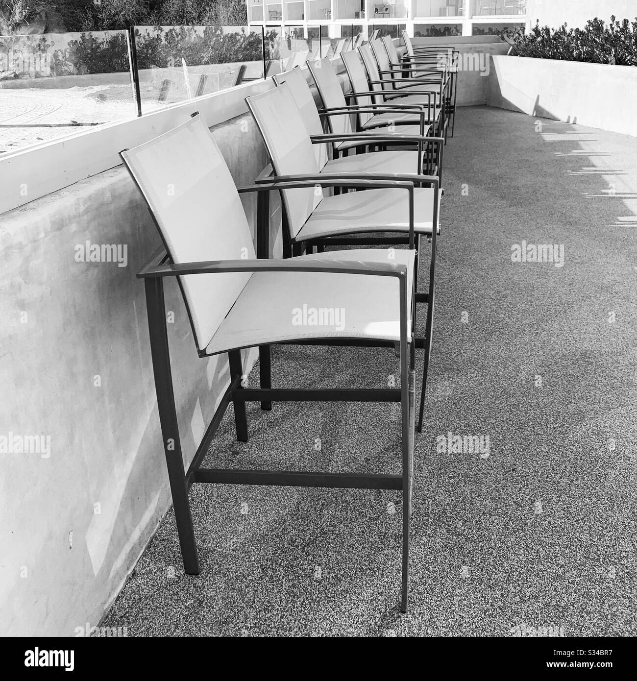 Chairs outside at the Dream Inn Santa Cruz, Santa Cruz, California, United States - Smartphone Captured Stock Image