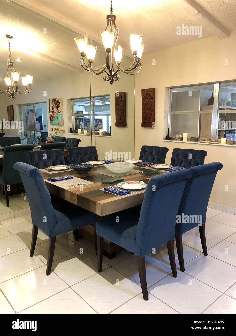 Dining room interior with table set for a meal. - Smartphone Captured Stock Image