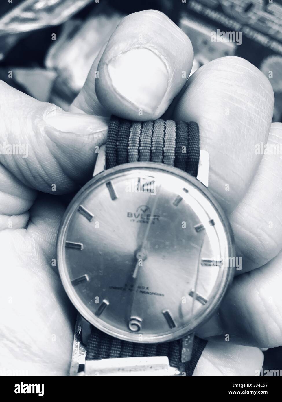 Vintage watch in mans hand - Smartphone Captured Stock Image