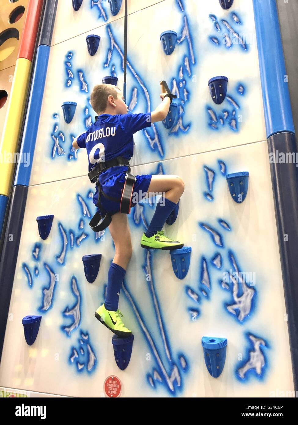 Boy on climbing wall - Smartphone Captured Stock Image