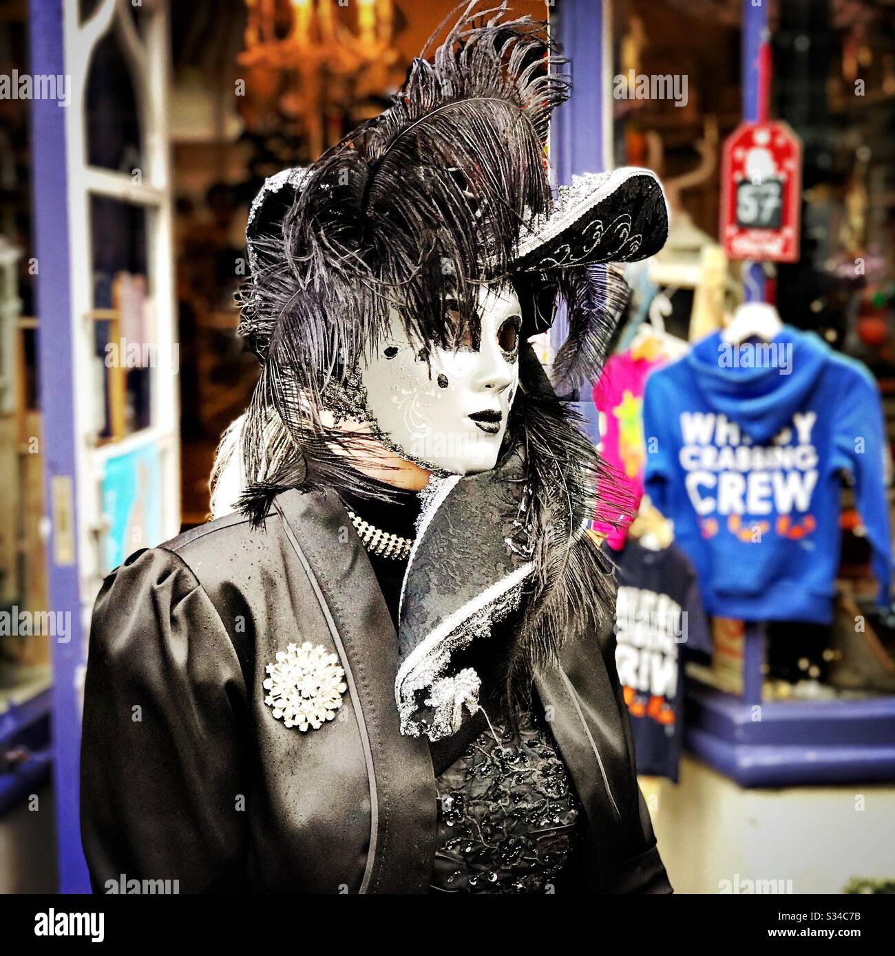 Person in a creative costume during a cosplay event. Whitby Goth Weekend. Vintage masquerade outfit - Smartphone Captured Stock Image