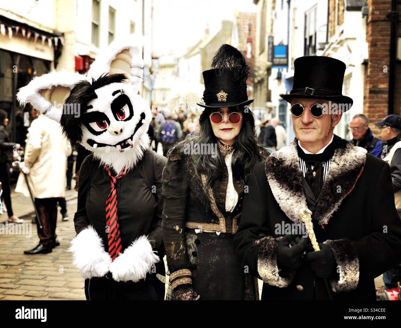 People in creative costumes during a cosplay event. Whitby Goth Weekend street photo. - Smartphone Captured Stock Image