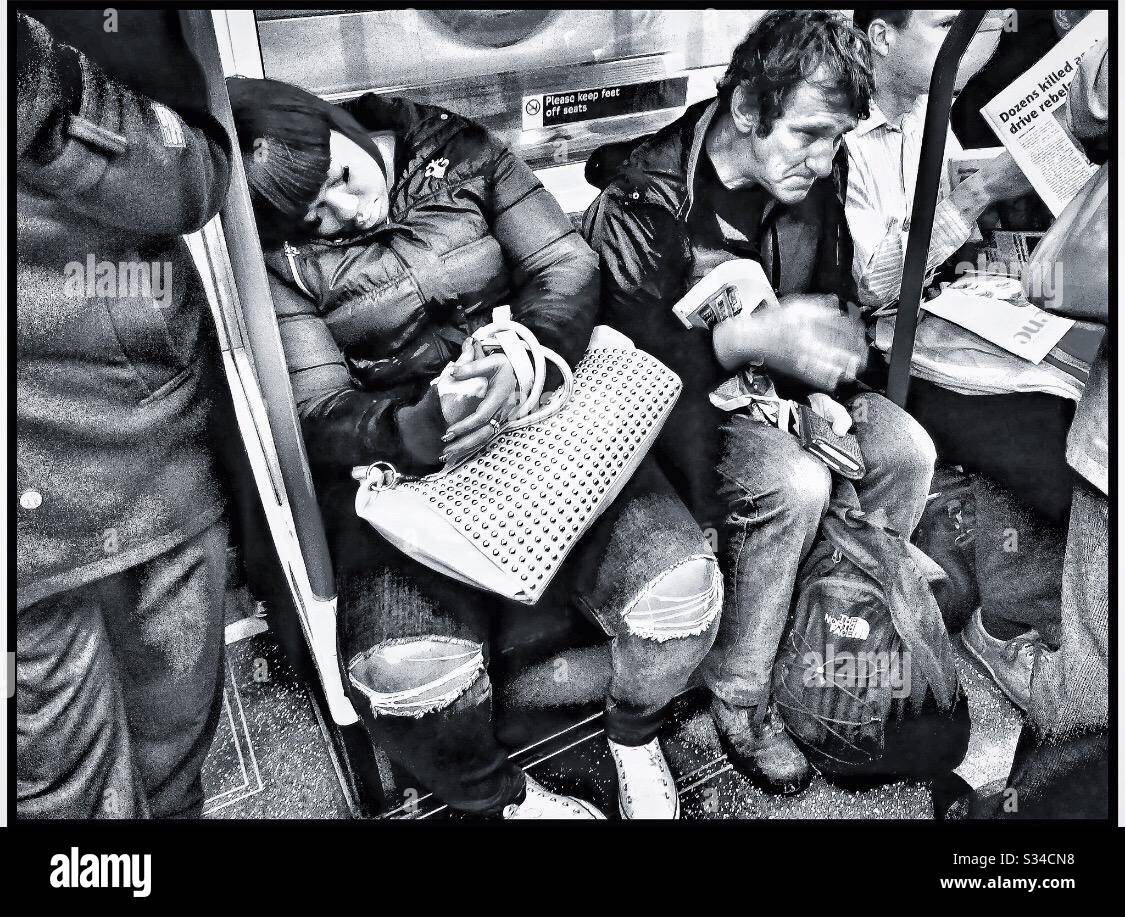 Commuters on a tube train. - Smartphone Captured Stock Image