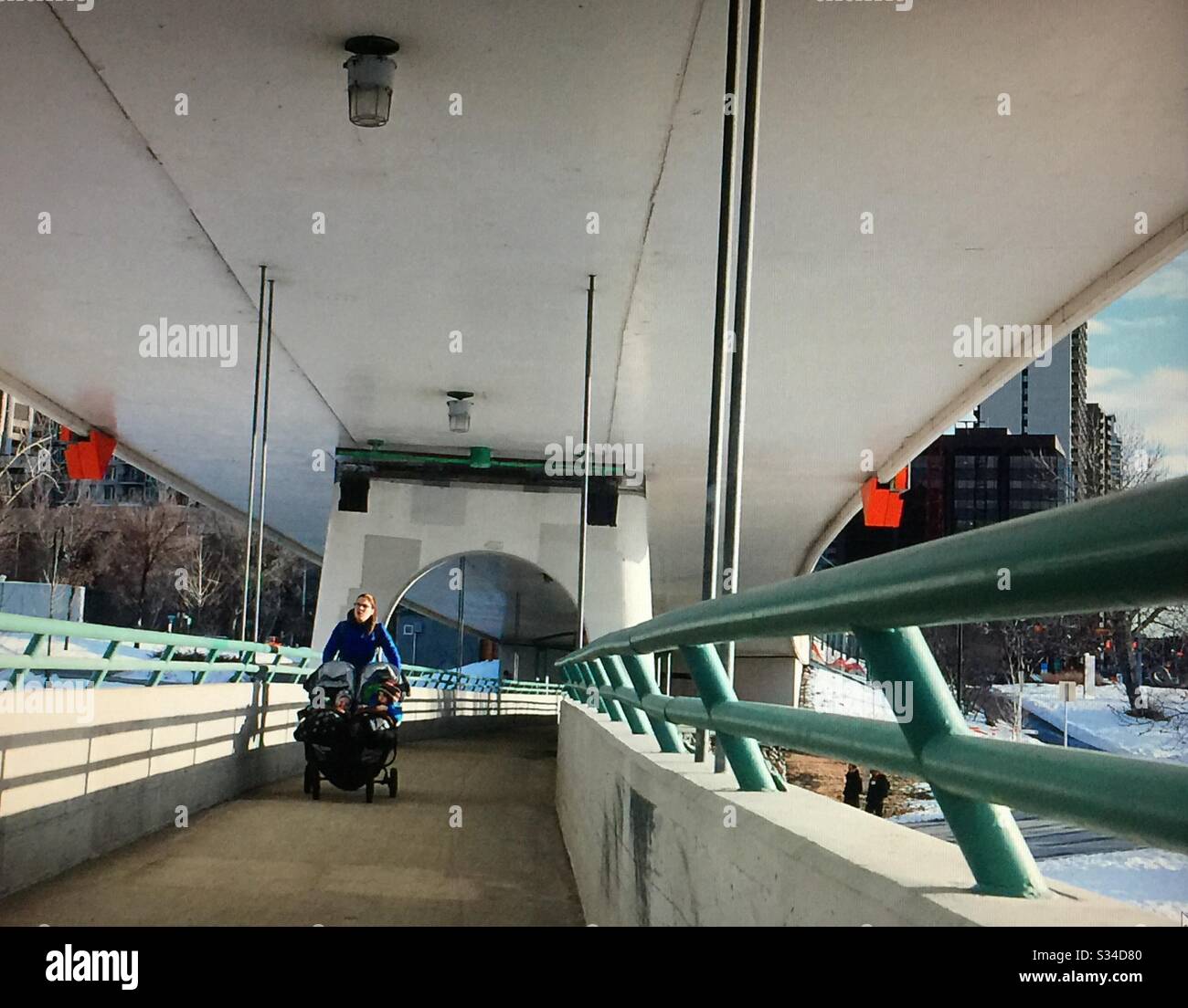 Downtown Calgary, CTrain bridge, Bow River, Calgary, Alberta, Canada , pedestrian foot bridge - Smartphone Captured Stock Image