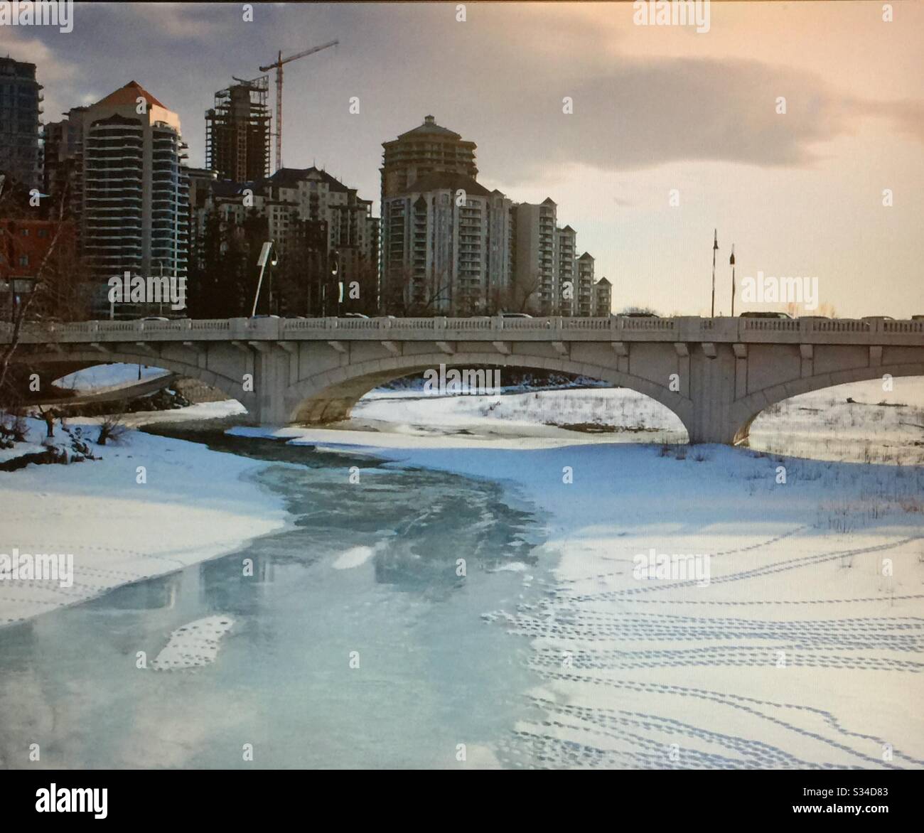 Downtown Calgary, 10th street bridge, Louise bridge, Bow River, Calgary, Alberta, Canada , pedestrian foot bridge - Smartphone Captured Stock Image
