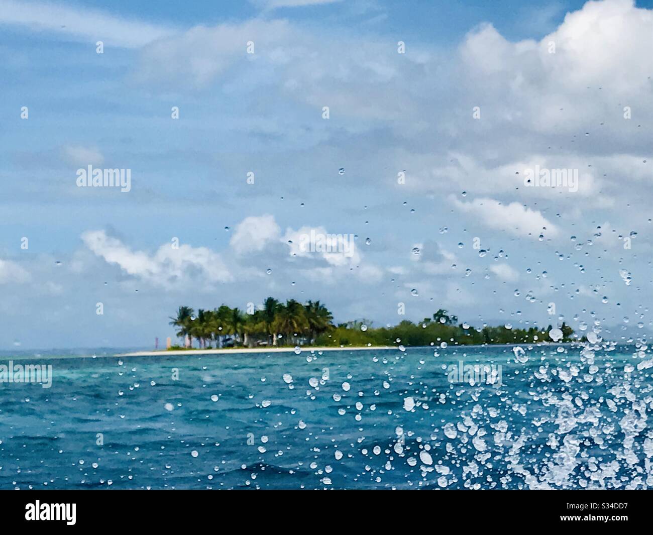 A refreshing splash of water from the boat ride, as we head to a secluded island. What a dream holiday to be in the middle of paradise. Stock Photo
