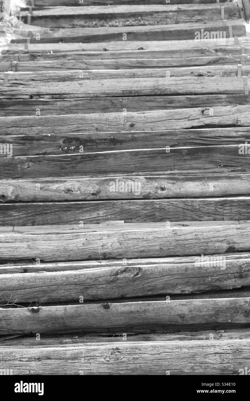 Texture, black white filter, wood steps, going down view, uneven boards, Stock Photo