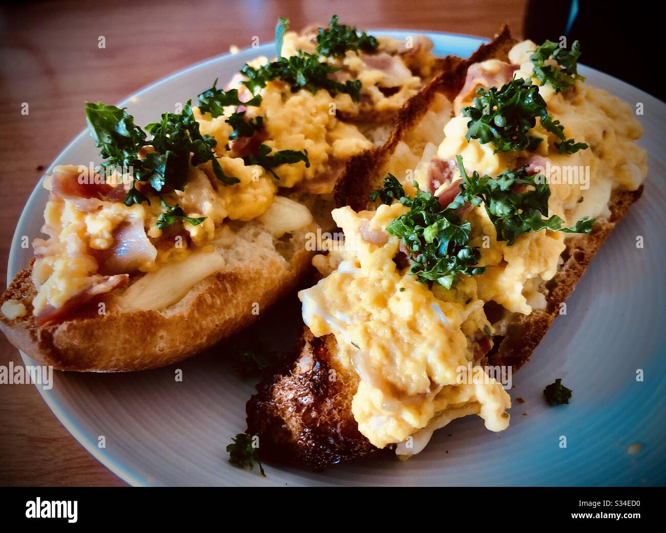 Scrambled eggs on toast for two, homemade healthy breakfast - Smartphone Captured Stock Image