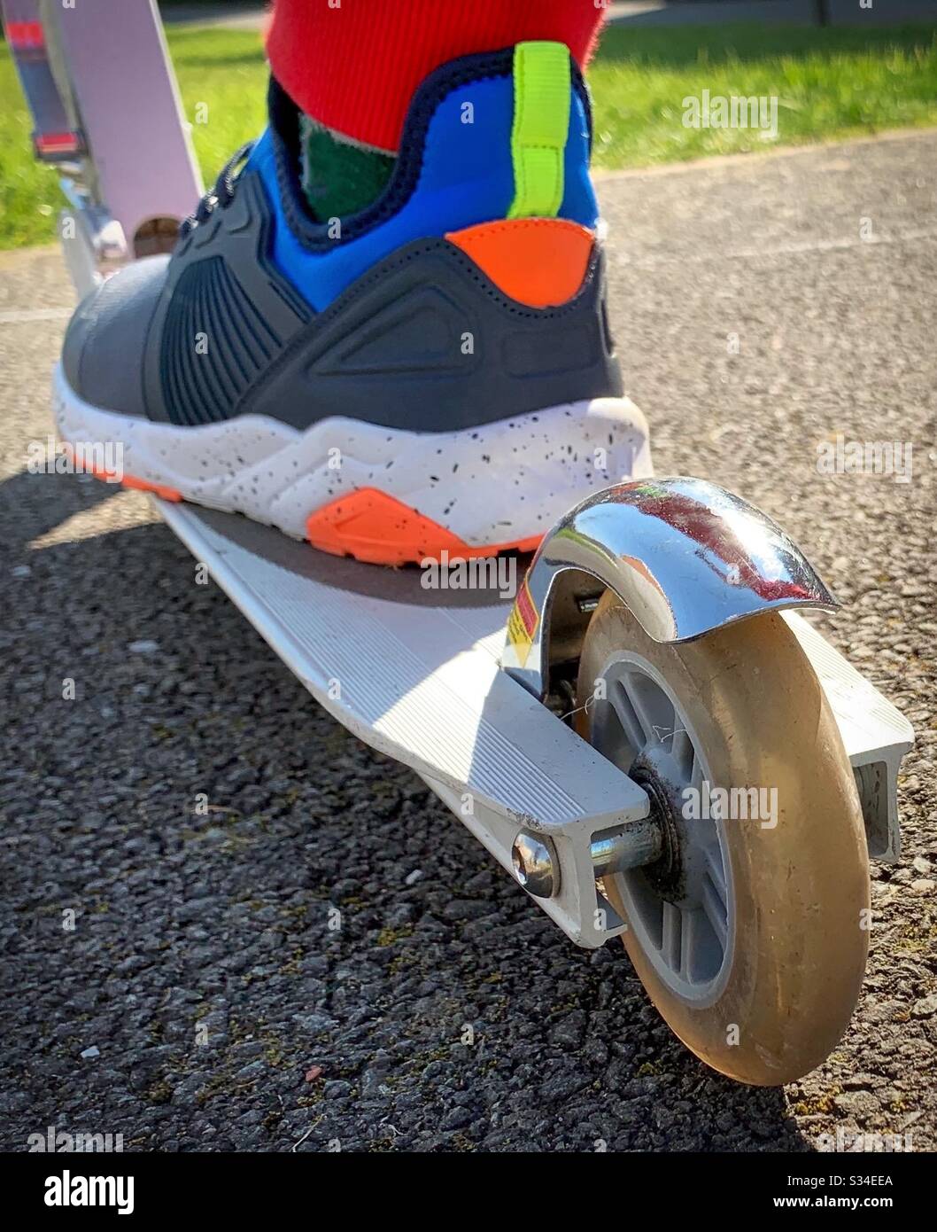 Foot on a scooter.  Getting out for exercise during covid coronavirus crisis.  Active lifestyle - Smartphone Captured Stock Image