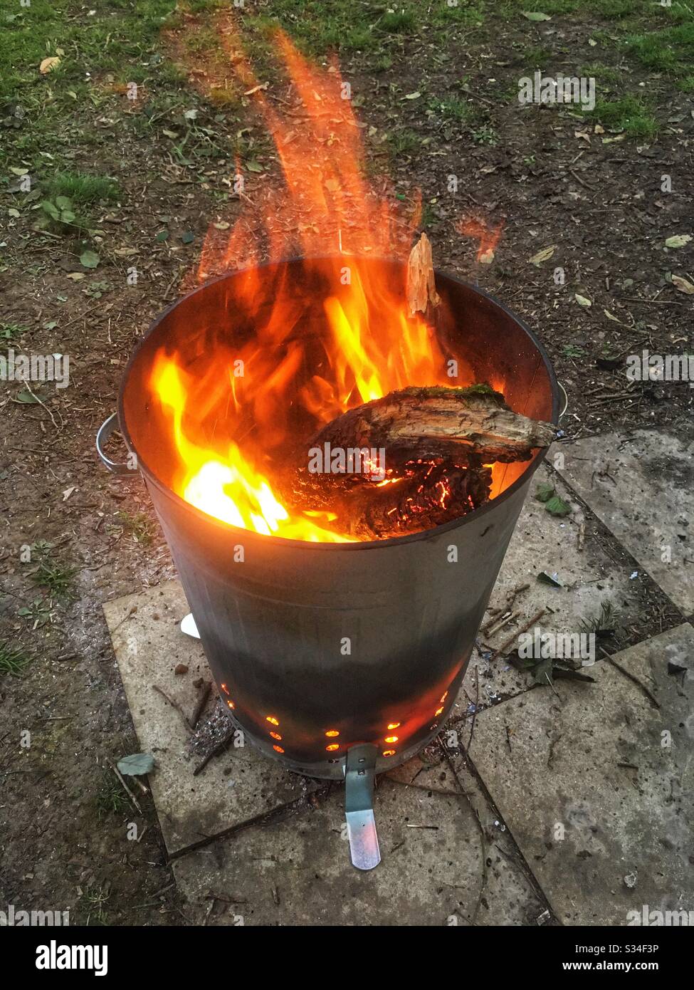 Garden incinerator burning brightly - Smartphone Captured Stock Image