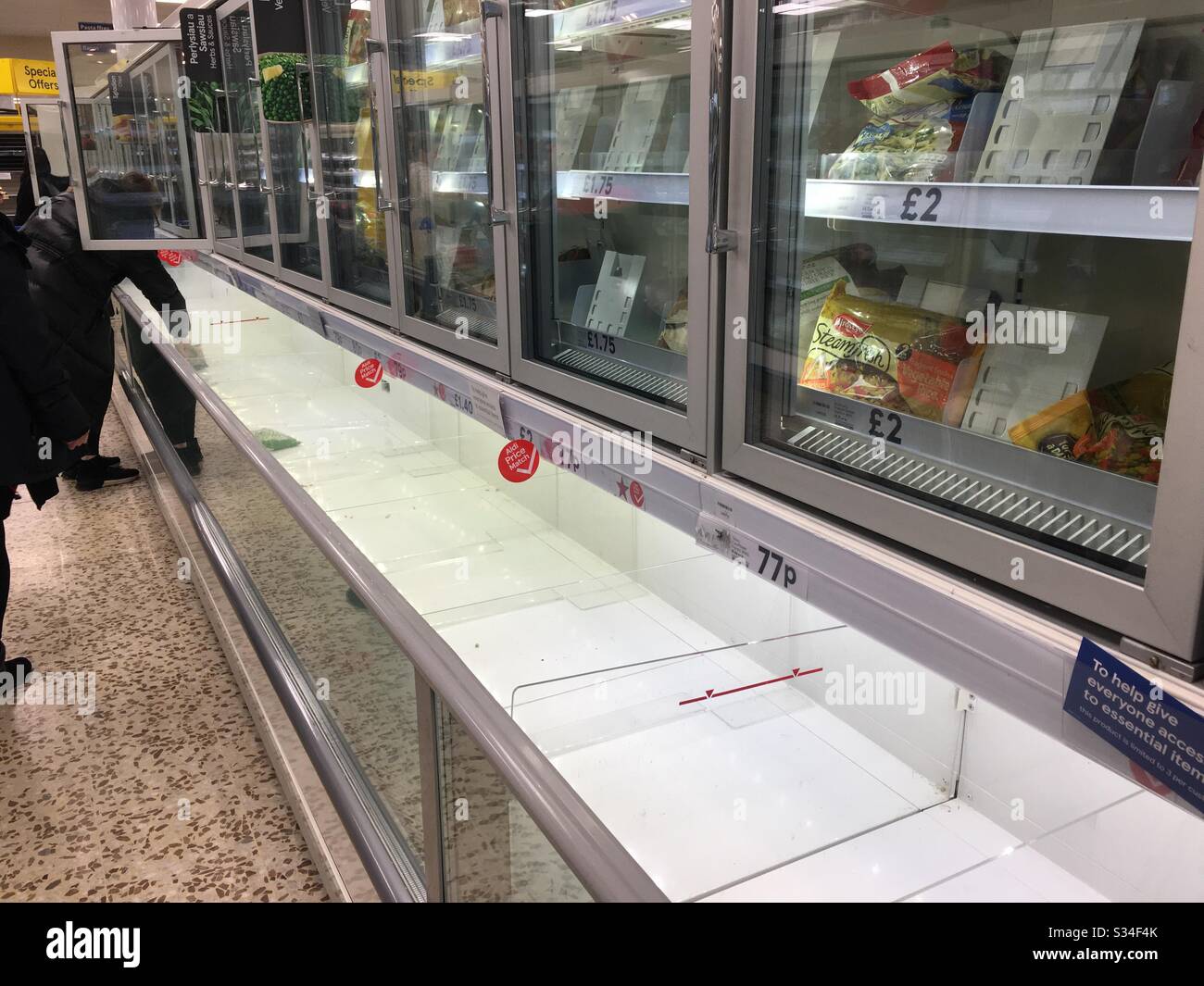 Empty freezer cabinets as a result of panic buying during the 2020 Coronavirus outbreak - Smartphone Captured Stock Image
