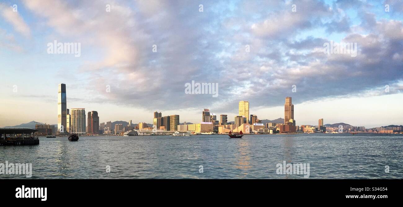 Panorama of West Kowloon, Tsim Sha Tsui, Hung Hom, viewed across Victoria Harbour from Tamar Park, Admiralty, Central, Hong Kong Island, late afternoon - Smartphone Captured Stock Image