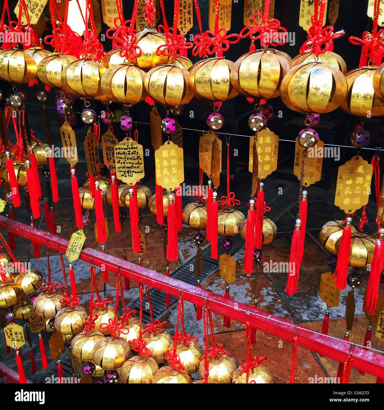 Written prayer requests to the gods in the Tin Hau Temple in Yau Ma Tei, Kowloon, Hong Kong - Smartphone Captured Stock Image