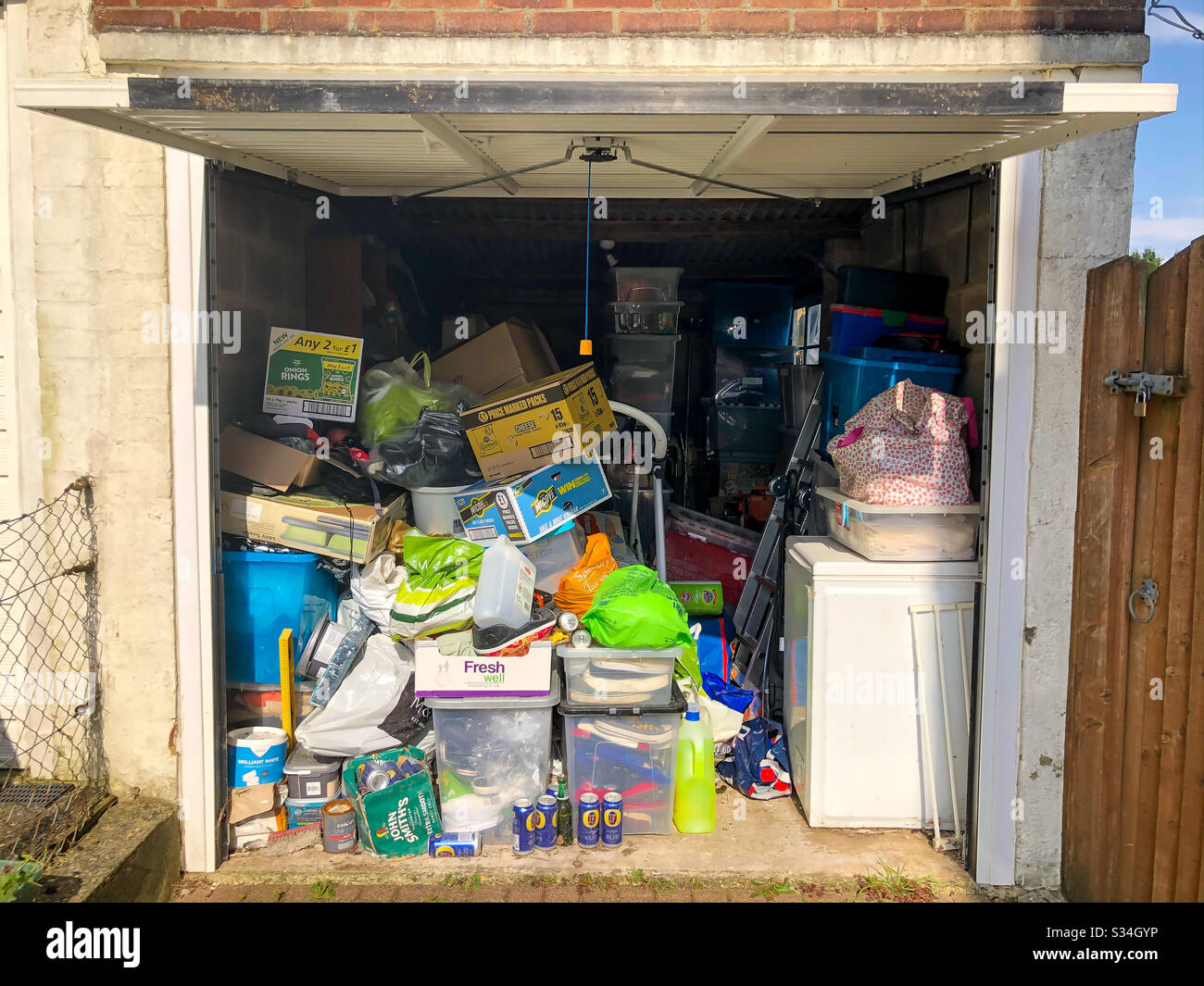 A messy garage full of stored possessions Stock Photo Alamy