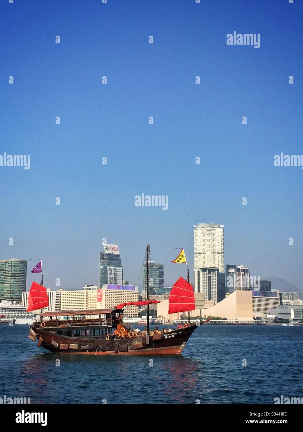The 'Aqua Luna', a replica traditional Chinese junk used for tourist sightseeing on Victoria Harbour, Hong Kong - Smartphone Captured Stock Image