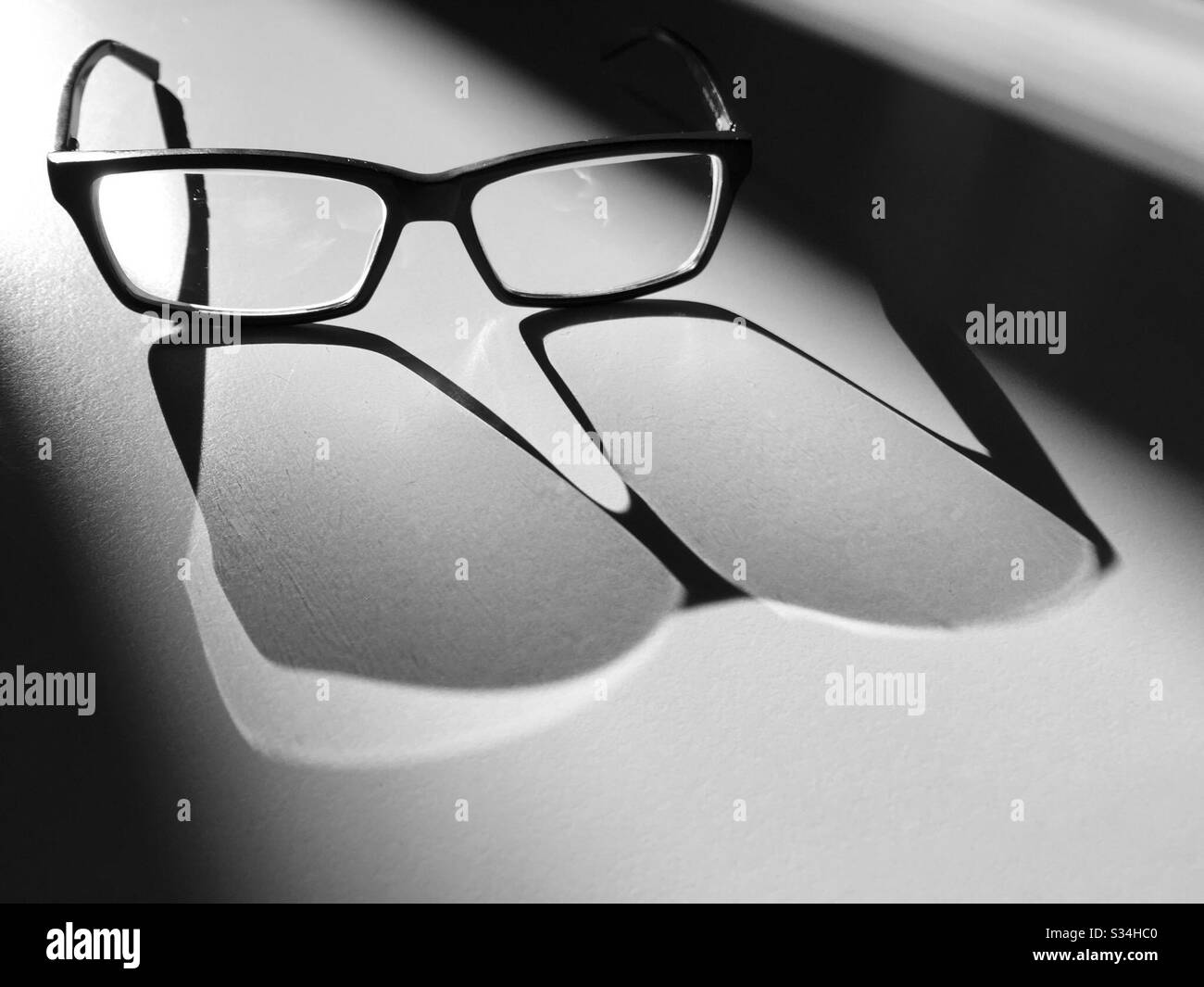 Glasses in the Light and Shadow - Smartphone Captured Stock Image