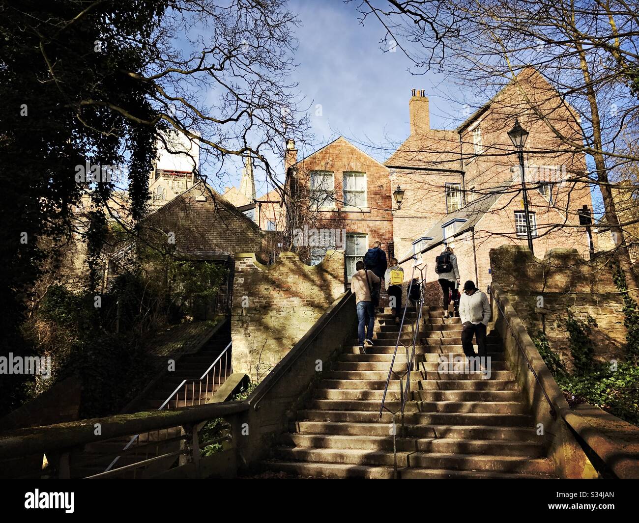 Architecture of Durham City, North East England. People use steps leading to Bow Lane from Kingsgate Bridge. - Smartphone Captured Stock Image