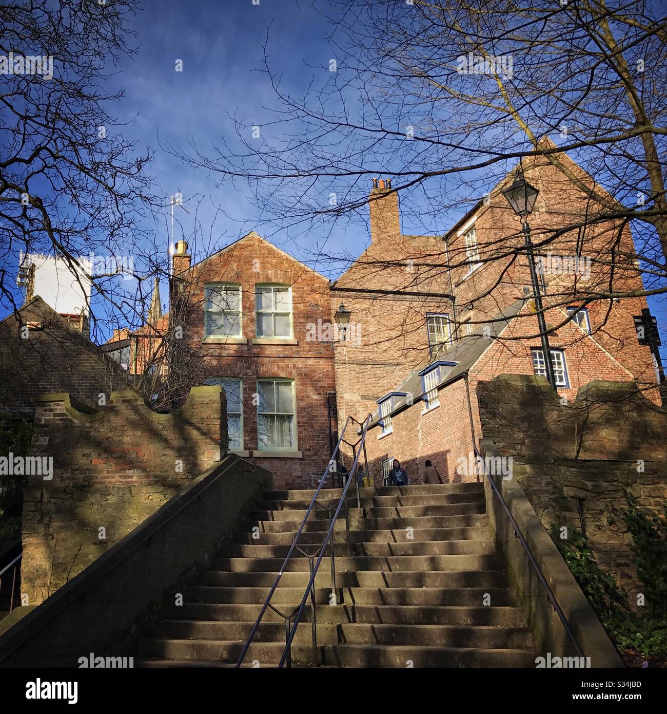 Architecture of Durham City, North East England. Red brick buildings of Bow Lane seen from Kingsgate Bridge - Smartphone Captured Stock Image