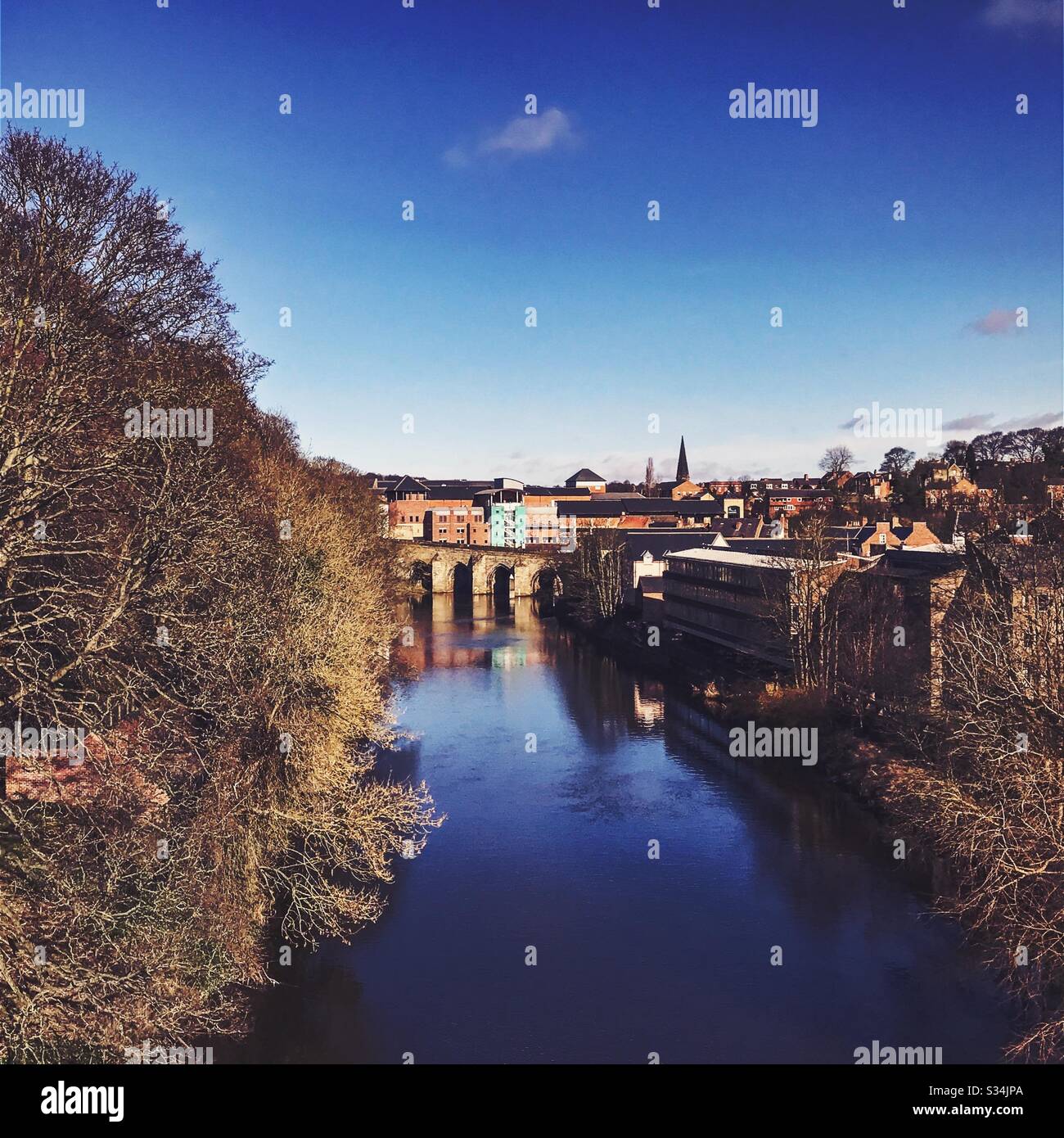 Architecture of Durham City, North East England. Elvet Bridge is seen from Kingsgate footbridge over the River Wear - Smartphone Captured Stock Image
