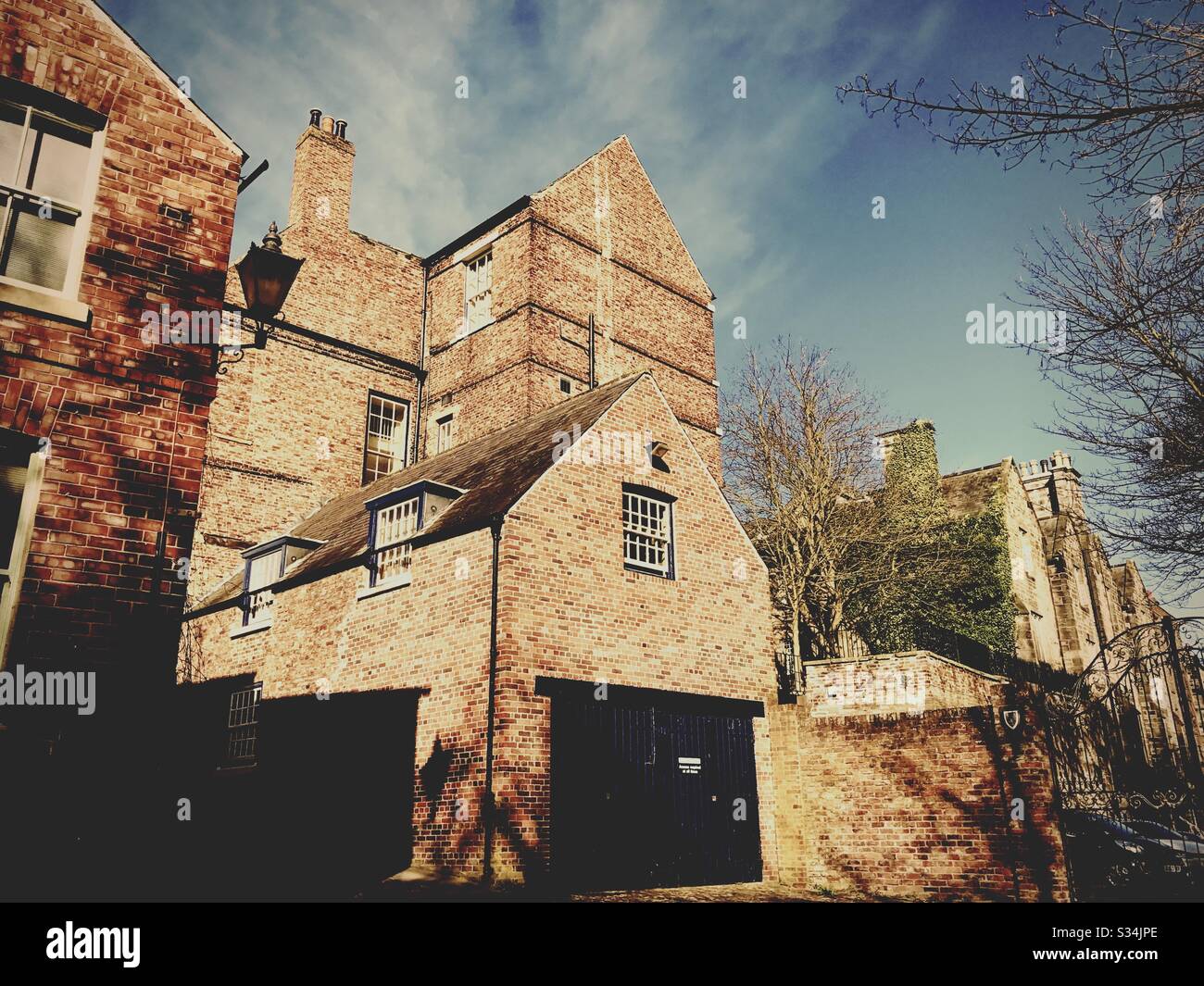Architecture of Durham City, North East England. Quaint backstreet scene. Red brick buildings of Bow Lane - Smartphone Captured Stock Image