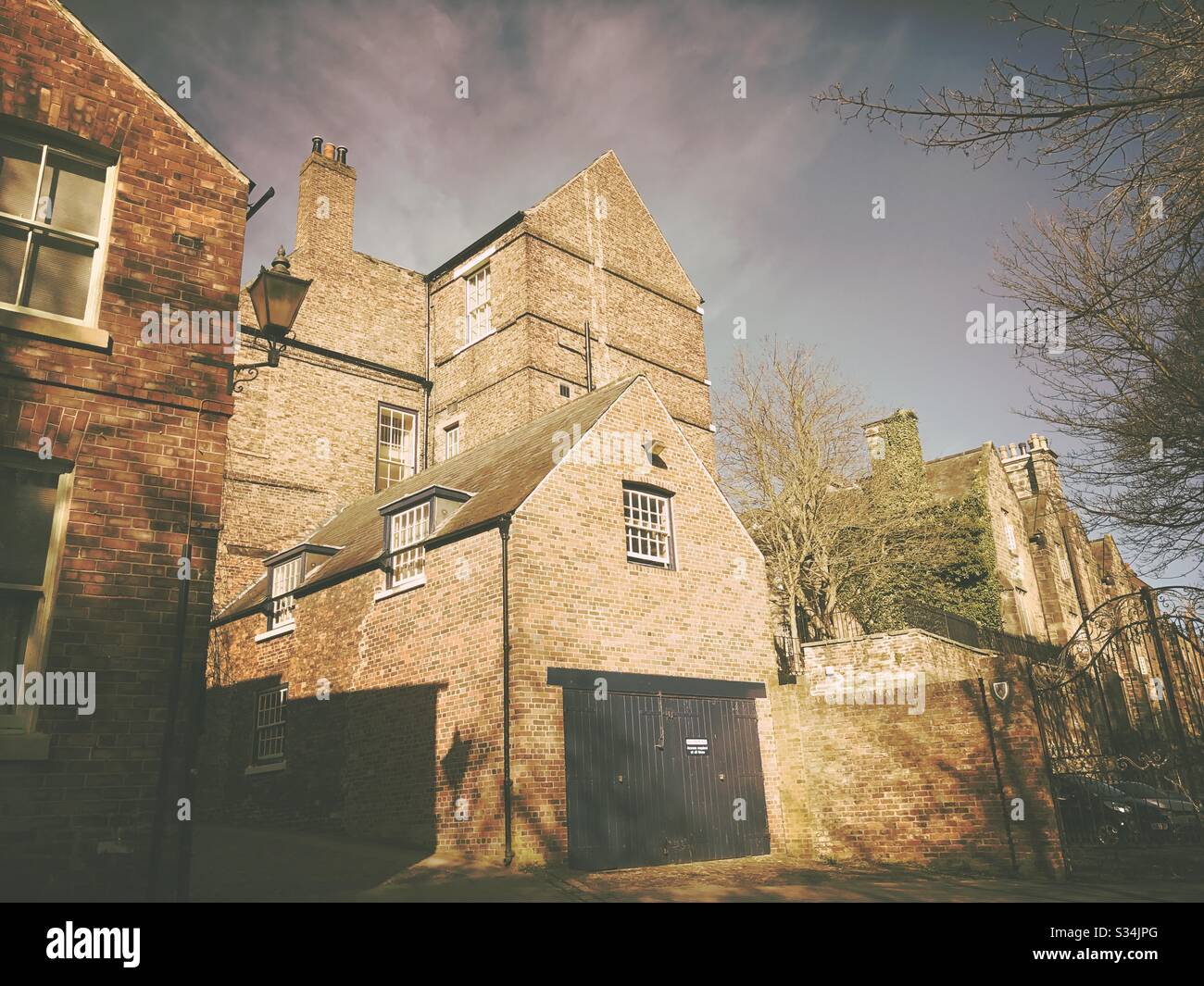 Architecture of Durham City, North East England. Quaint backstreet scene. Red brick buildings of Bow Lane - Smartphone Captured Stock Image