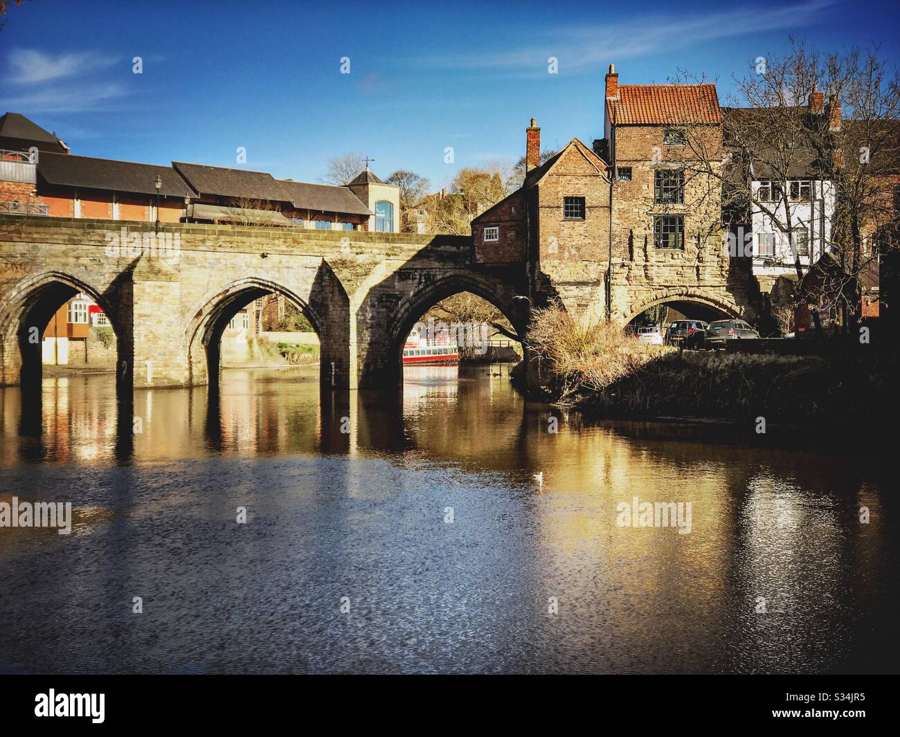 Architecture of Durham City, North East England. Scenic view of Elvet Bridge over the River Wear. Medieval masonry arch bridge. - Smartphone Captured Stock Image