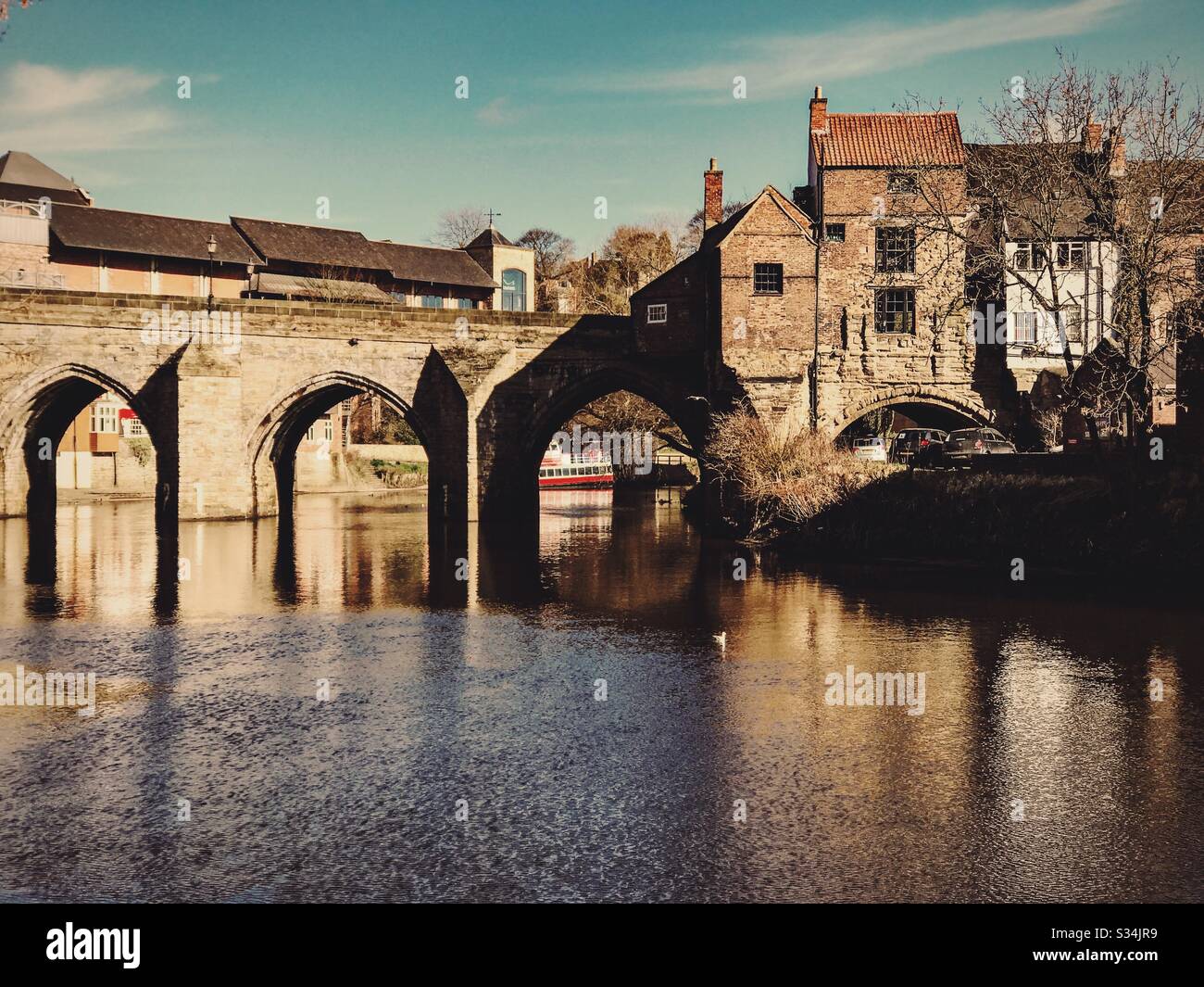 Architecture of Durham City, North East England. Scenic view of Elvet Bridge over the River Wear. Medieval masonry arch bridge. - Smartphone Captured Stock Image
