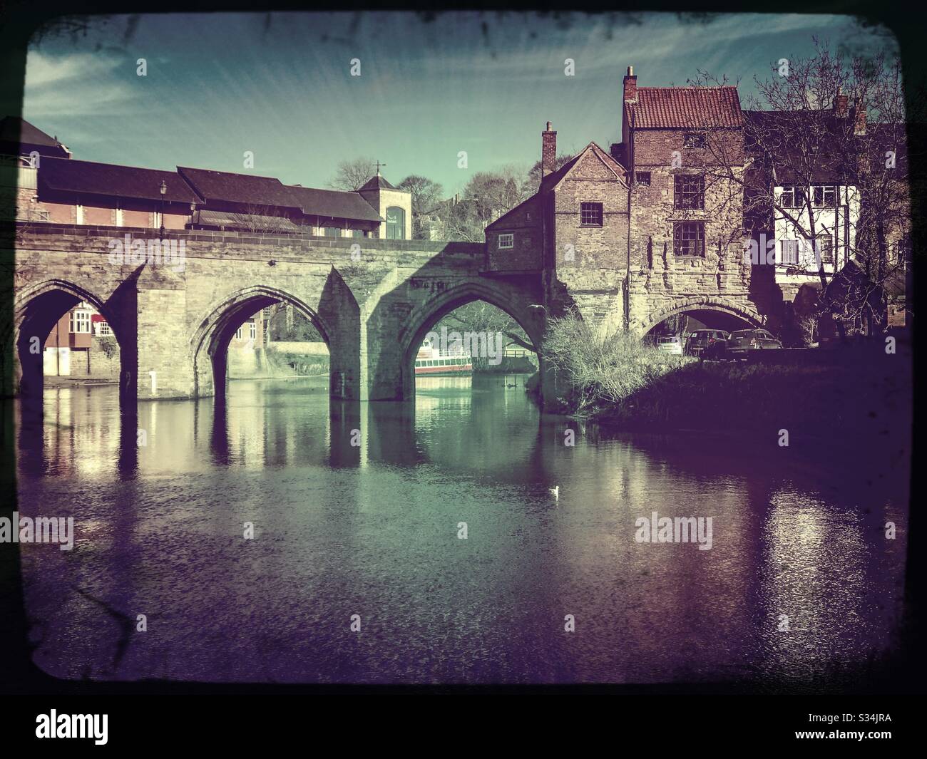 Architecture of Durham City, North East England. Scenic view of Elvet Bridge over the River Wear. Medieval masonry arch bridge. - Smartphone Captured Stock Image
