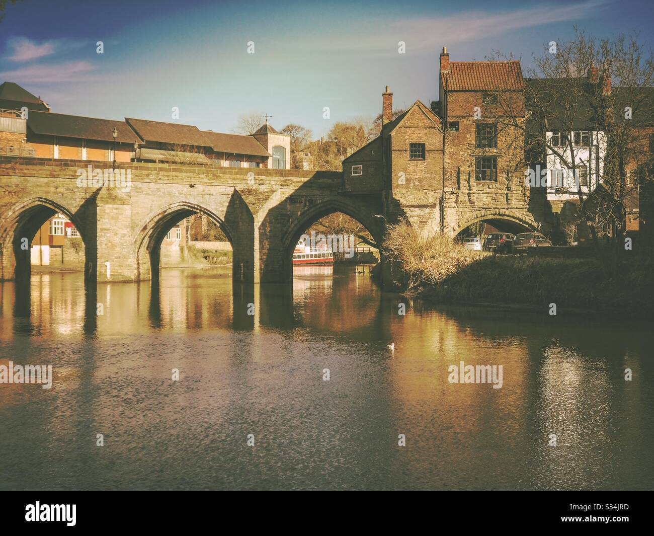 Architecture of Durham City, North East England. Scenic view of Elvet Bridge over the River Wear. Medieval masonry arch bridge. - Smartphone Captured Stock Image