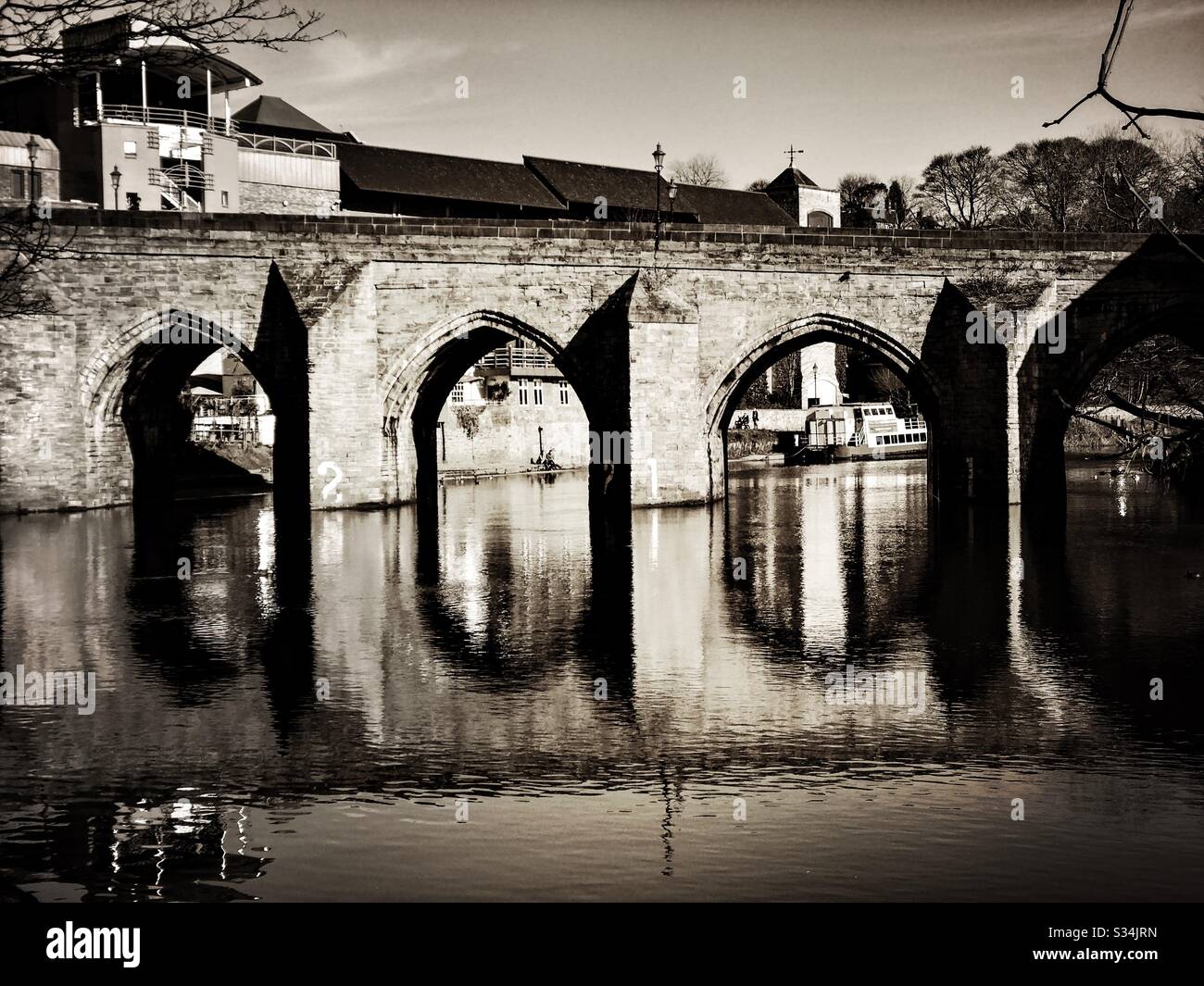 Architecture of Durham City, North East England. Scenic view of Elvet Bridge over the River Wear. Medieval masonry arch bridge. - Smartphone Captured Stock Image