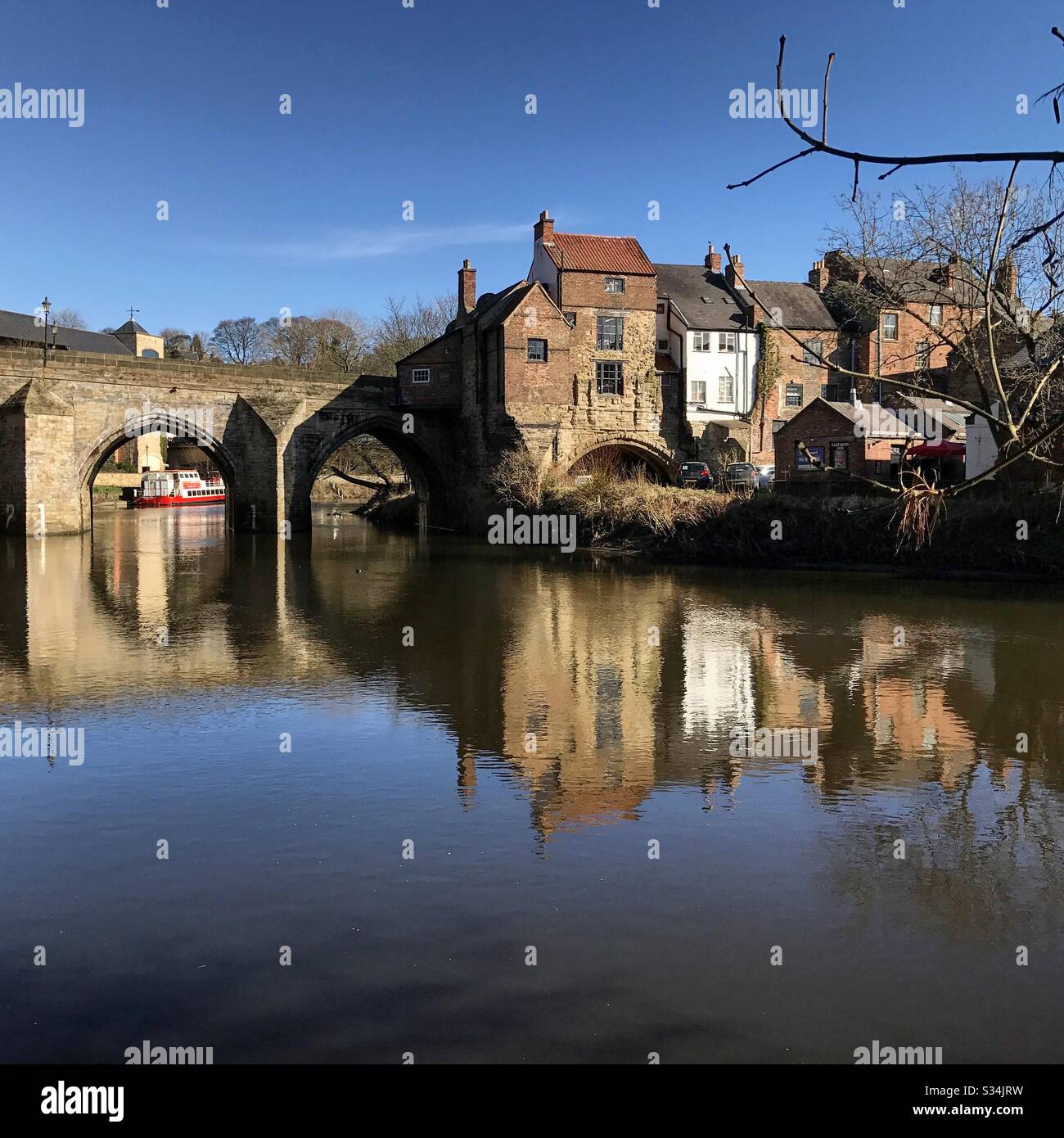 Architecture of Durham City, North East England. Scenic view of Elvet Bridge over the River Wear. Medieval masonry arch bridge. - Smartphone Captured Stock Image