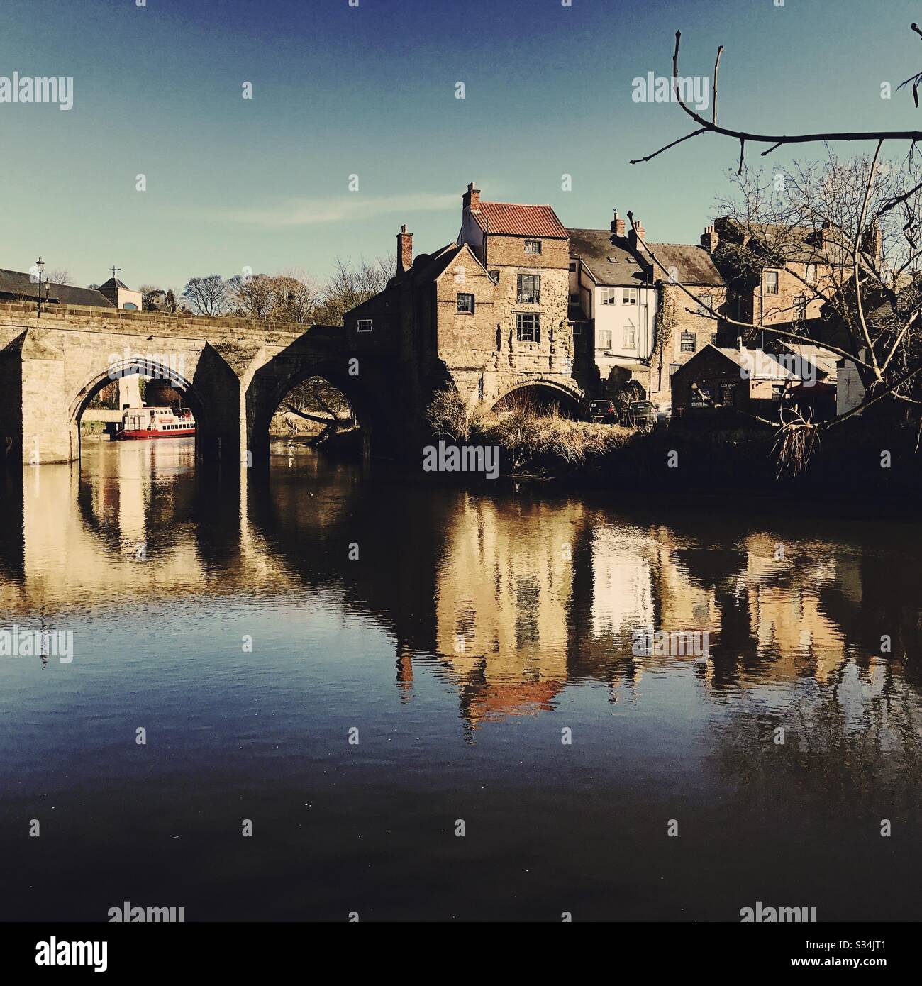 Architecture of Durham City, North East England. Scenic view of Elvet Bridge over the River Wear. Medieval masonry arch bridge. - Smartphone Captured Stock Image